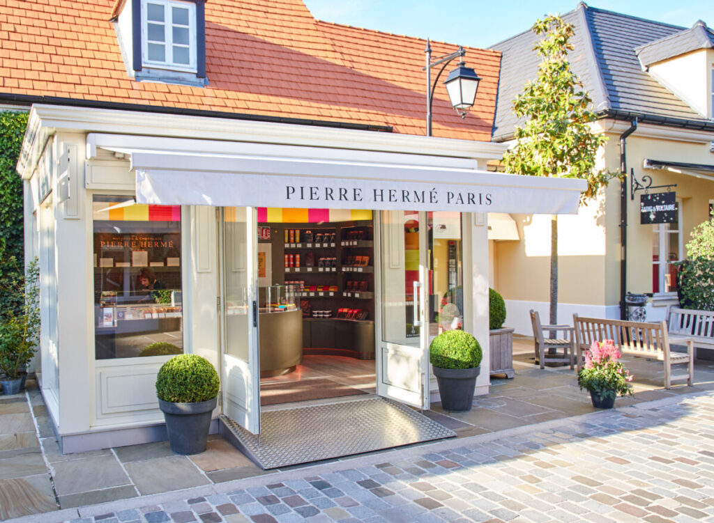 Front and entrance of the boutique of Pierre Herme in La Vallee Village, Paris
