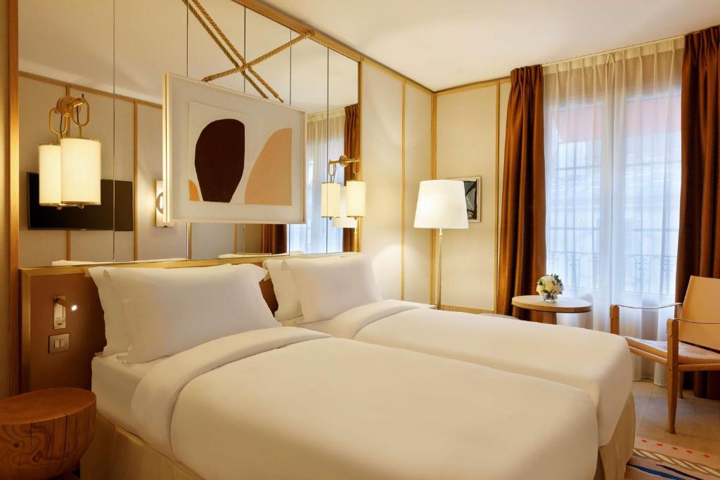 Two beds in Le Belgrand Hotel Paris Champs Elysees, Tapestry Collection by Hilton