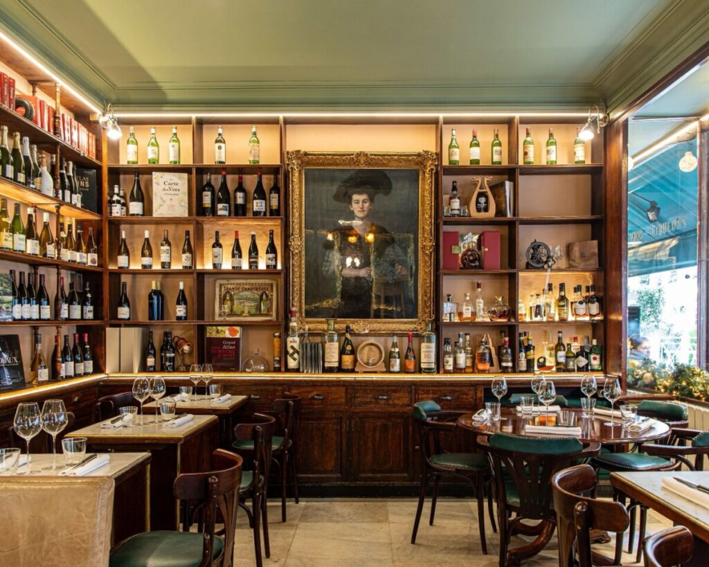 Charming interior of Le Bistrot Flaubert in Paris, featuring warm lighting and inviting seating for diners