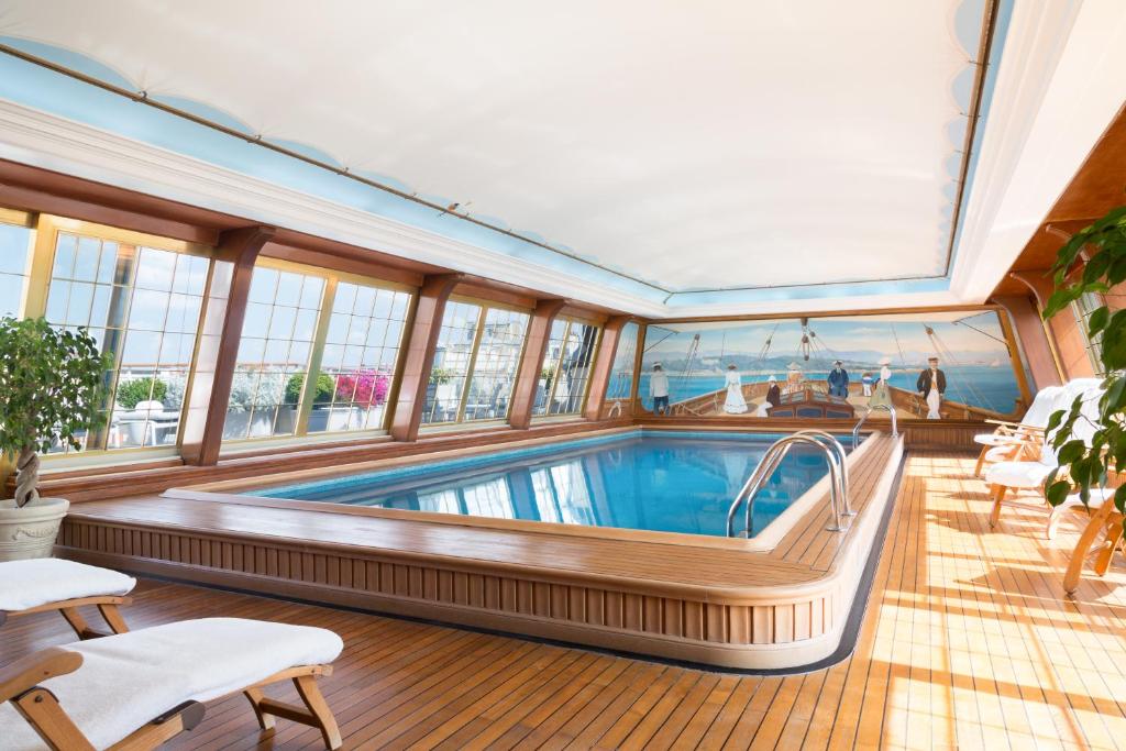 The luxurious indoor pool at Le Bristol Paris, featuring a tranquil atmosphere and sophisticated decor in the spa area.