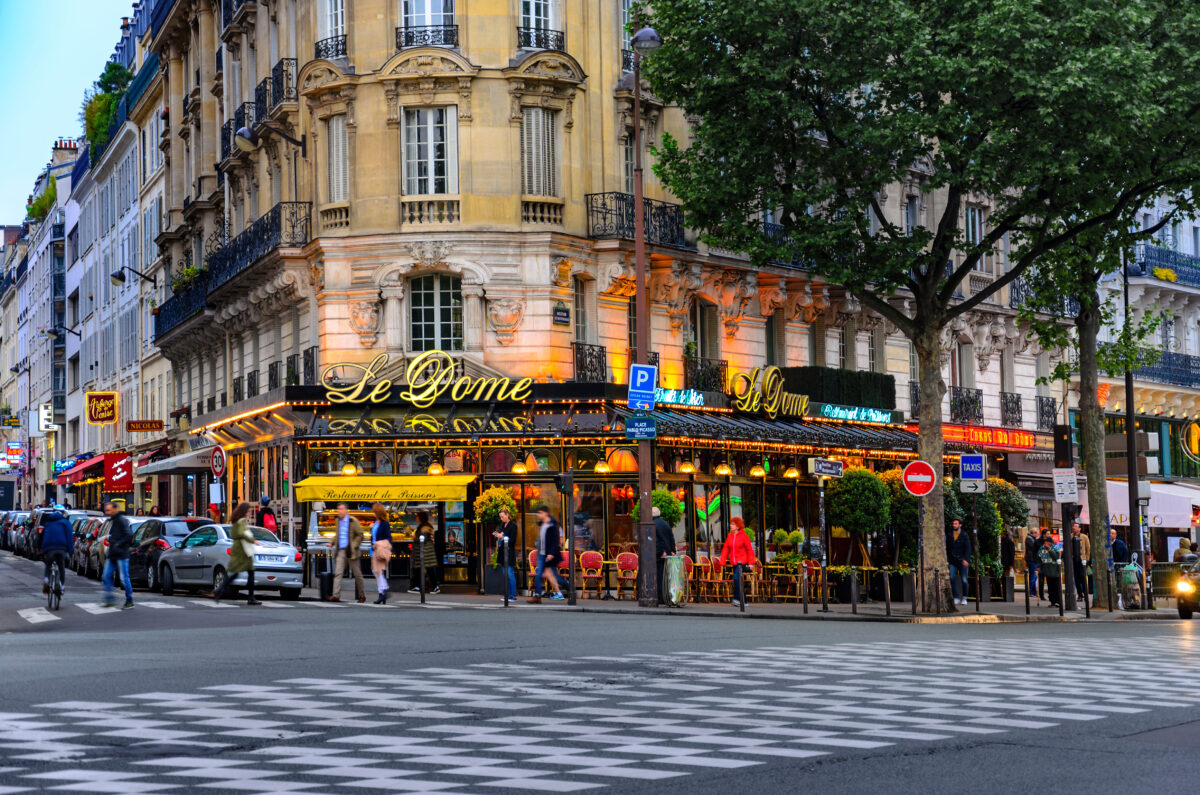 Famous Le Dome cafe in Montparnasse, Paris, known for attracting artists like Picasso and Modigliani in the past.
