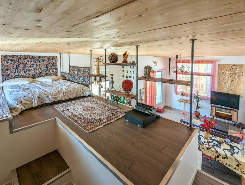 Bed look and room interior in Le Penthouse de Boulogne