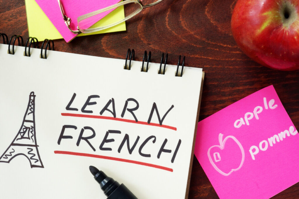 Learn French words written in the notepad with a drawing of Eiffel tower on the side