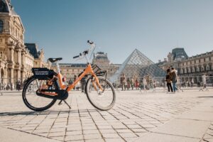 A bike in front of the Louvre pyramid in Paris, France