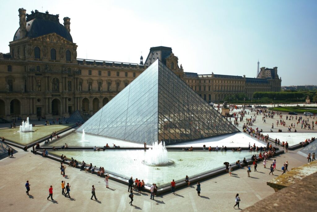 Morning crowd in Louvre Pyramid, Paris, France