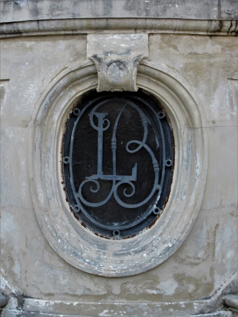 A close-up of a window at Maison Lorenz, with details of the frame and design.