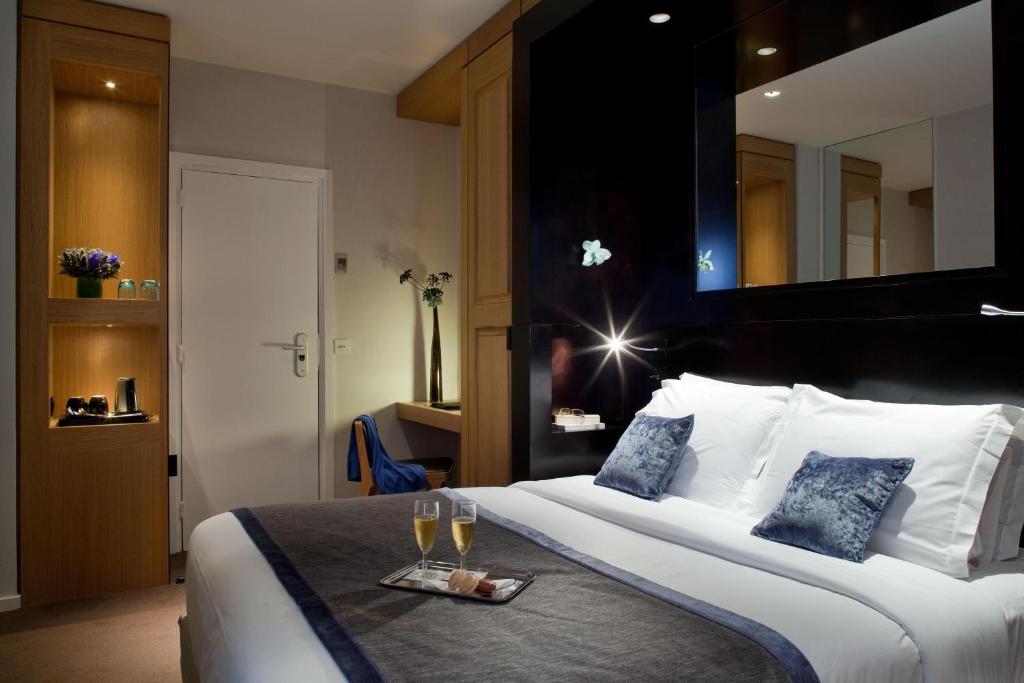 Marceau Champs-Elysées' rooms epitomize sophistication, featuring chic furnishings, luxurious bedding, and modern amenities.