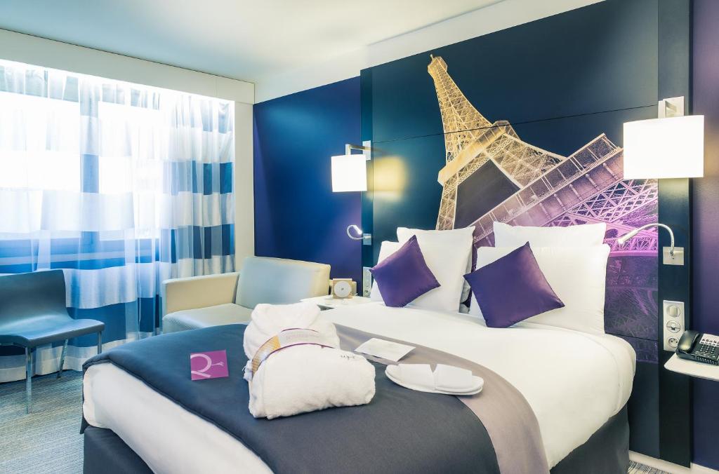 The rooms at the Mercure Paris Centre Tour Eiffel combine modern comforts with elegant furniture, chic décor, and expansive views of the famous Eiffel Tower.