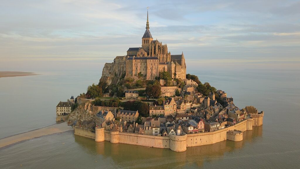 Mont-Saint-Michel seen from the sky at sunrise.