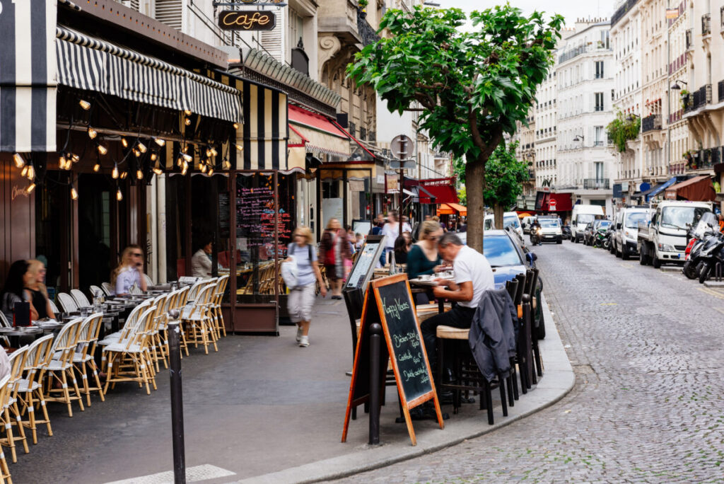 Montmartre Parisian street scene with a bustling outdoor café.