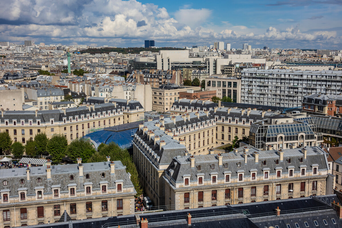 Panoramic aerial shot of Paris's 11th Arrondissement, highlighting its architecture and vibrant city life