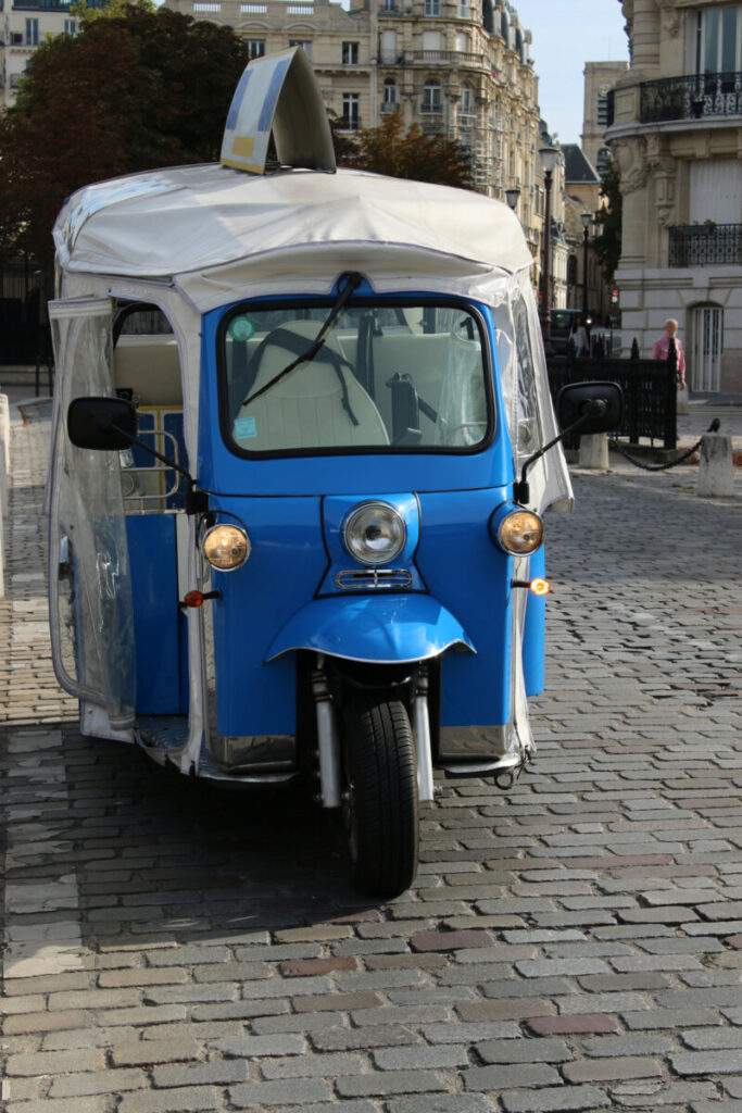 Bicycle taxi navigating the streets of Paris