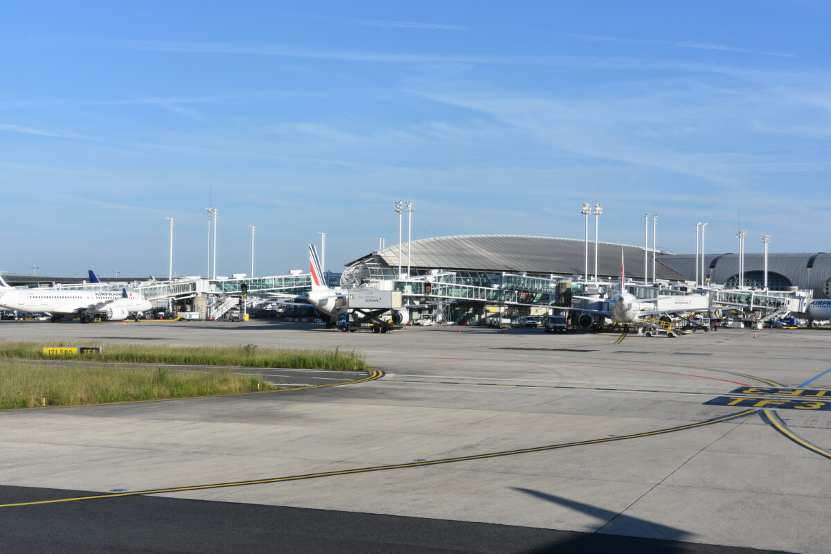Planes on a terminal at Paris Charles de Gaulle Airport in Roissy-en-France, France