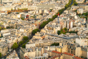 Aerial view of the 14th Arrondissement in Paris, showcasing residential buildings and tree-lined streets.