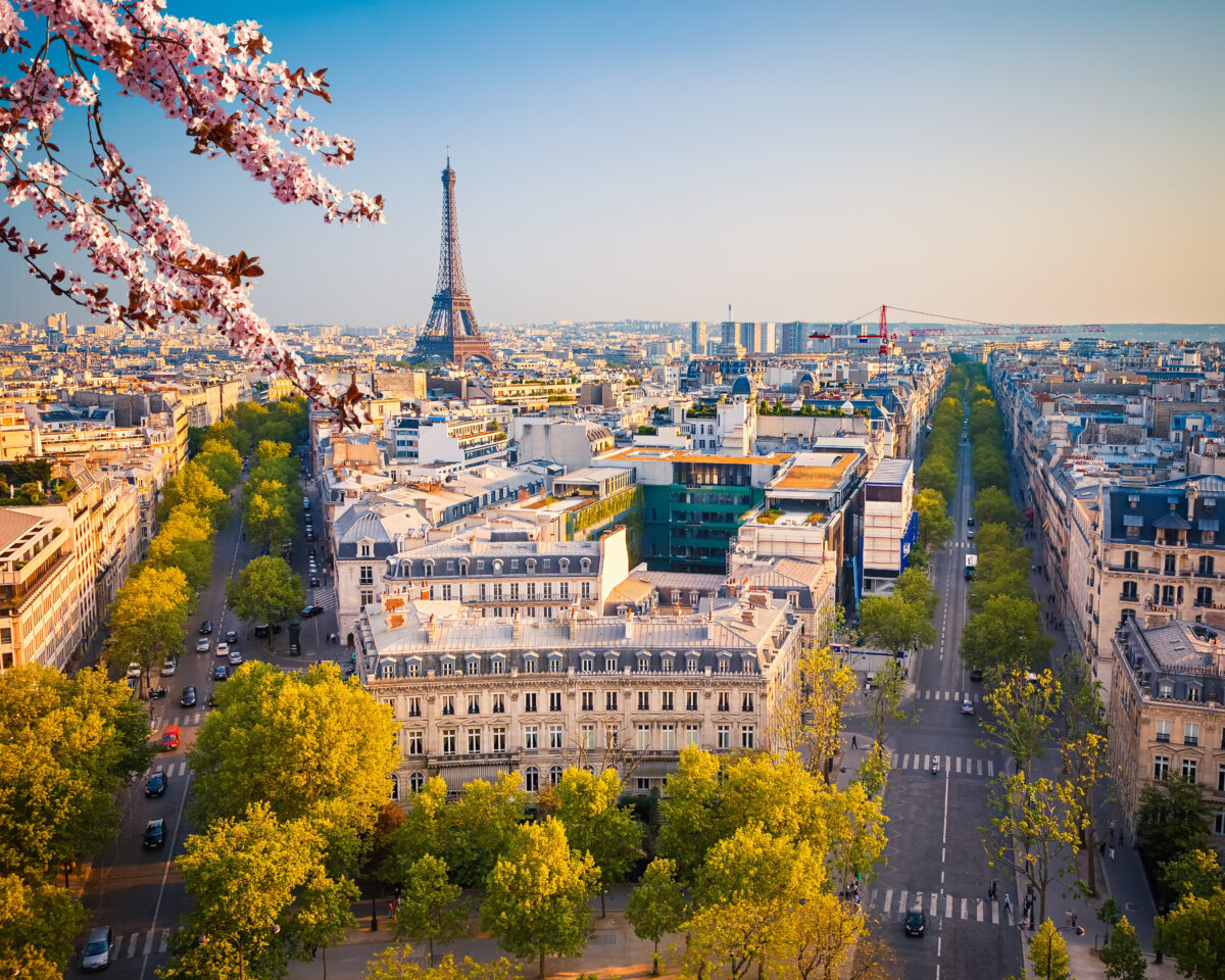 Springtime aerial view of Paris, highlighting vibrant greenery
