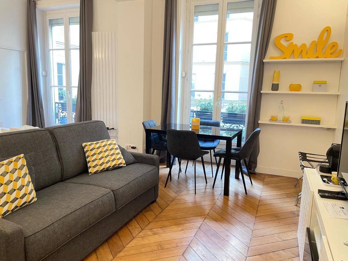 Couch on a living area on a room in Paris Square