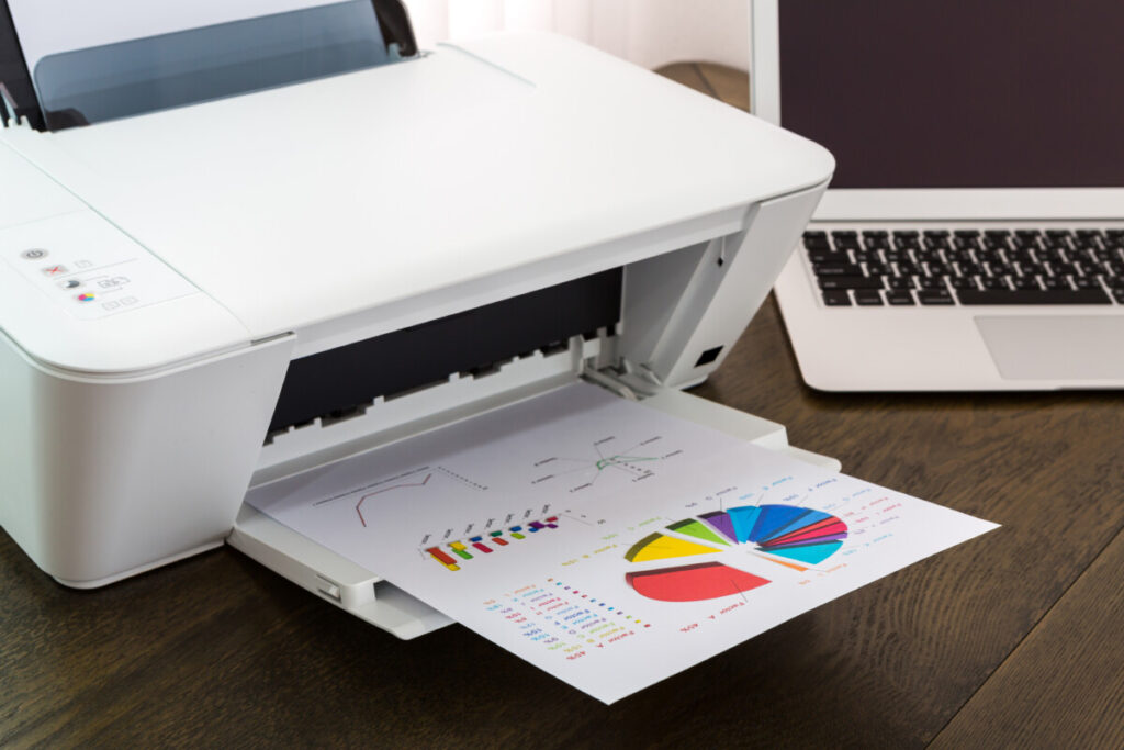 Printer and a printed file on a wooden table
