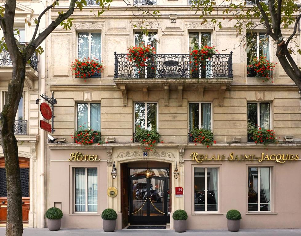 Relais Saint Jacques welcomes guests with a historic facade and a charming entrance, offering a glimpse into its classic Parisian character.