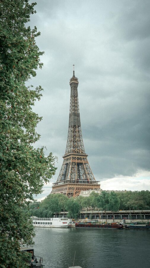 Seine river cruise ships floating on river near Eiffel Tower