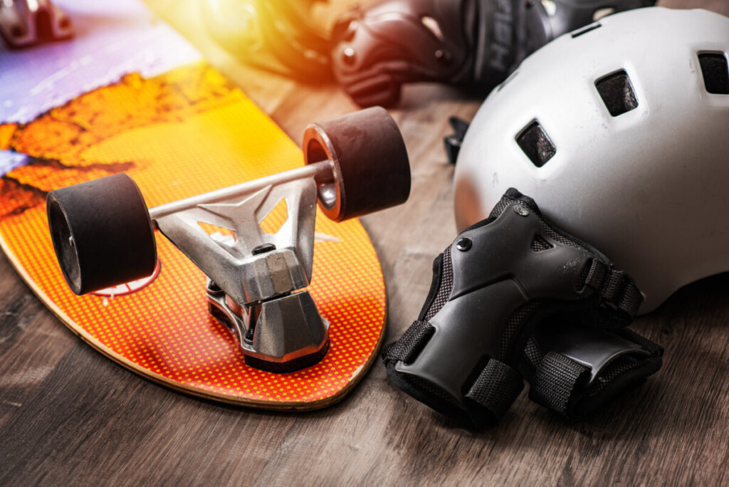 Close-up of Skateboard Safety and Equipment including a helmet and knee pads