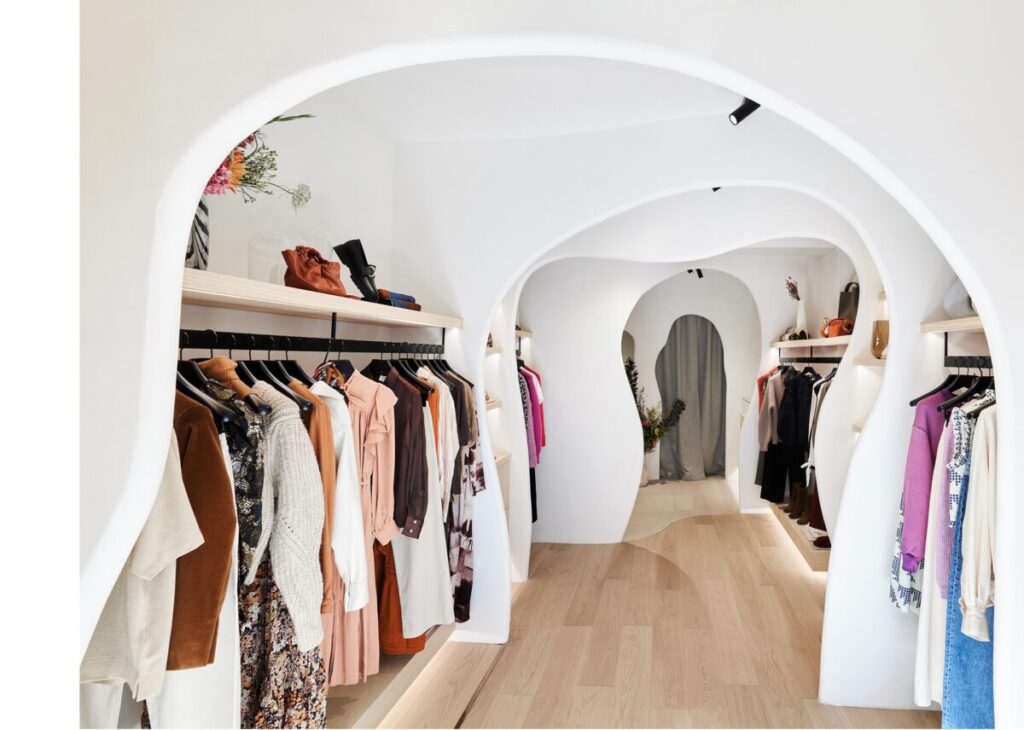 Interior of Smallable shop neatly displayed clothing in Paris, France.
