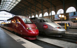 SNCF train at Gare du Nord station in Paris, showcasing the iconic architecture and bustling atmosphere of the station.