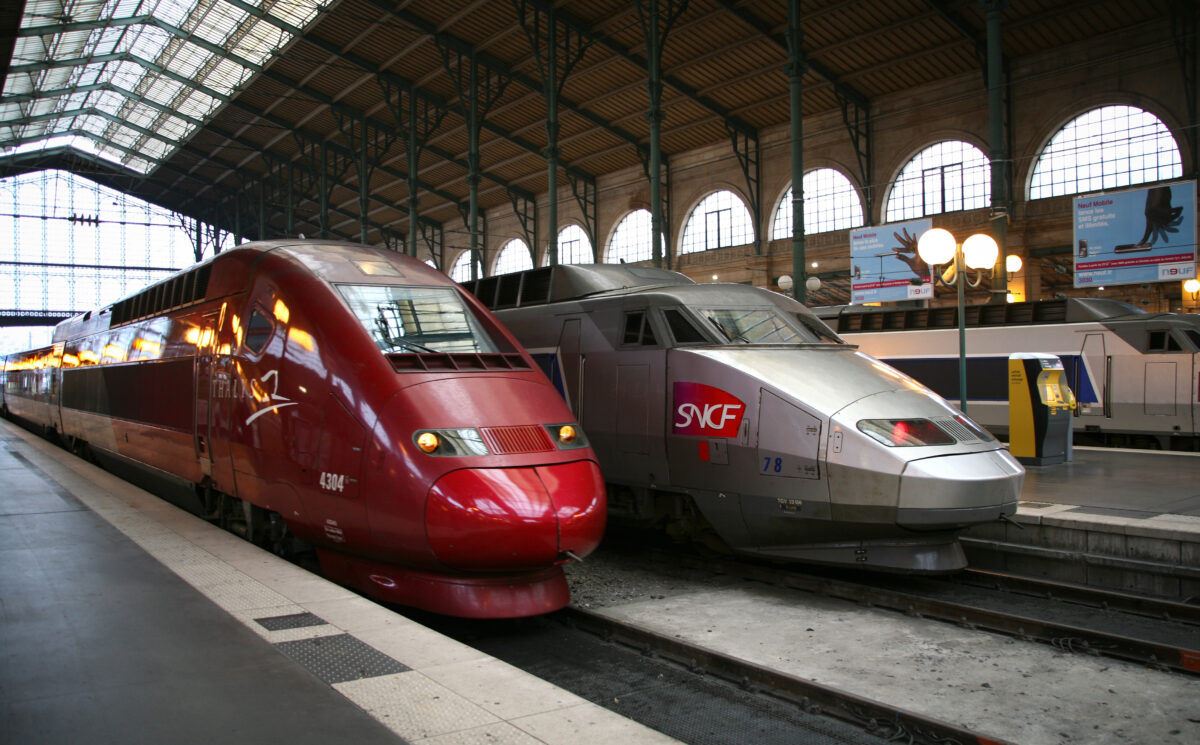 SNCF train at Gare du Nord station in Paris, showcasing the iconic architecture and bustling atmosphere of the station.