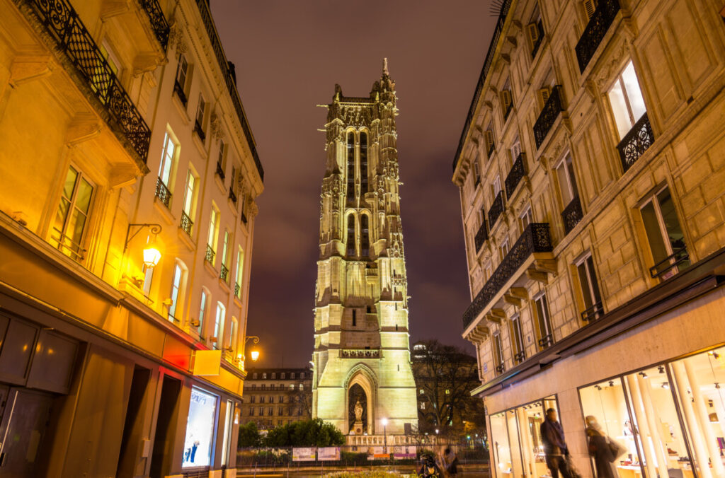 Exterior of the Tour Saint-Jacques Paris and skyline at night in Paris, France