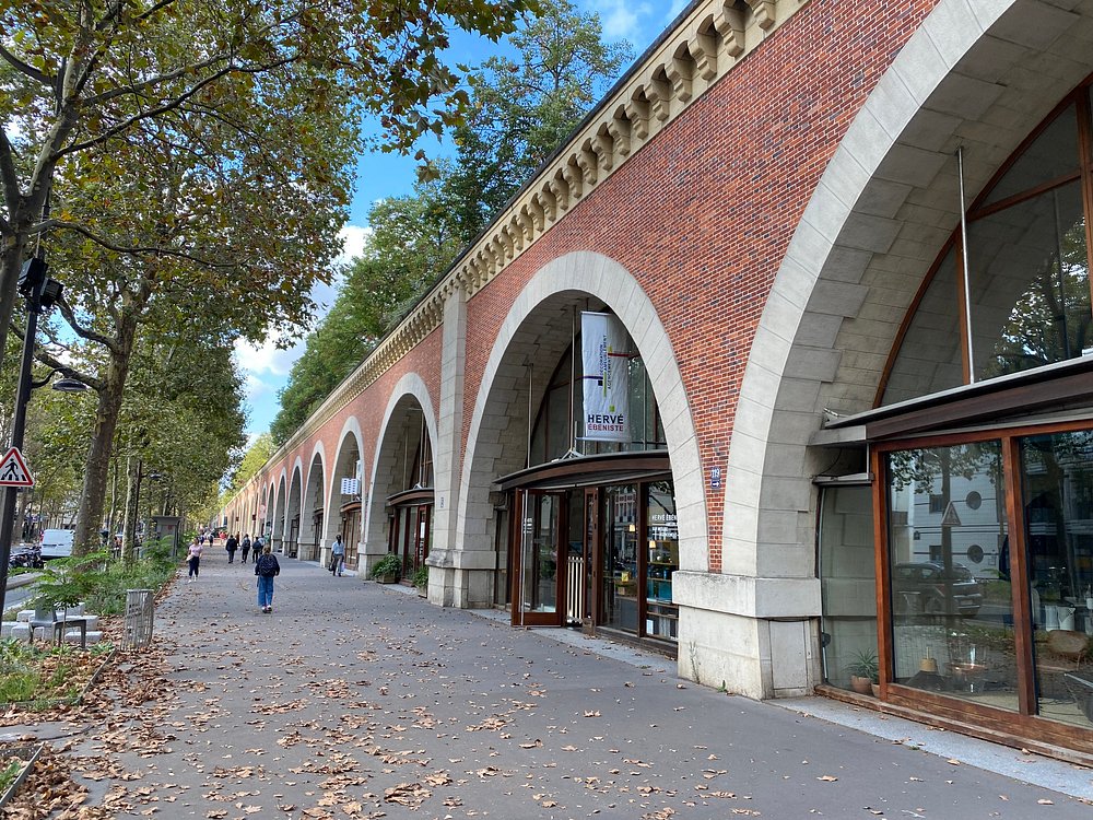 The Viaduc des Arts in Paris, France, showcasing a brick building with elegant side arches.
