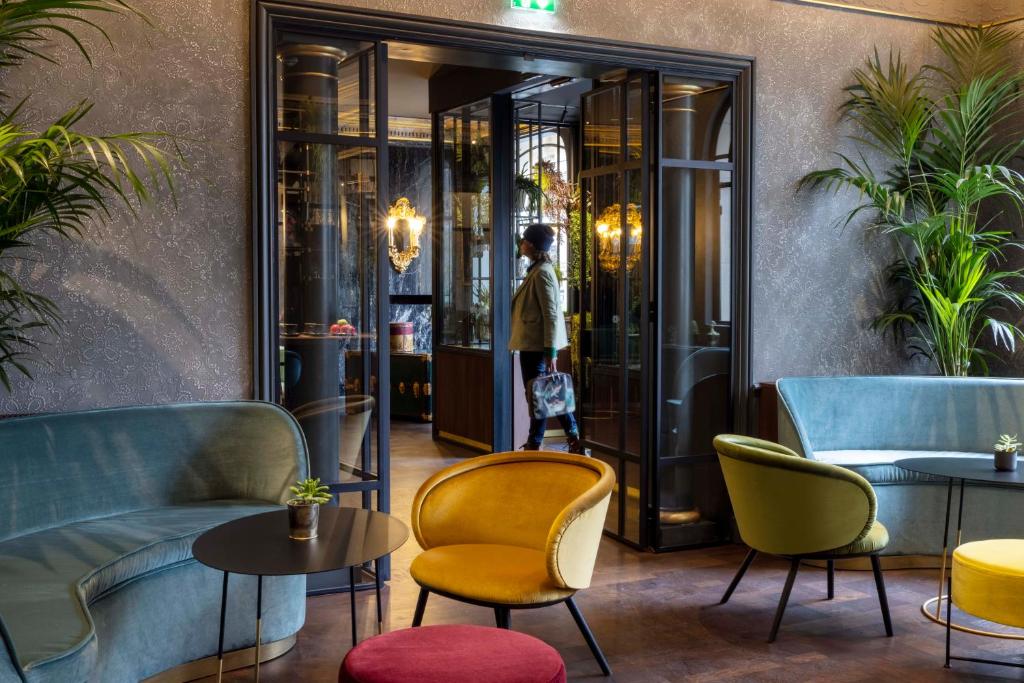 "Victoria Palace Hotel welcomes guests with an opulent facade and a timeless elegance that echoes Parisian grandeur.